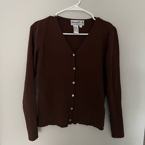 Deep brown long sleeve with buttons going down.